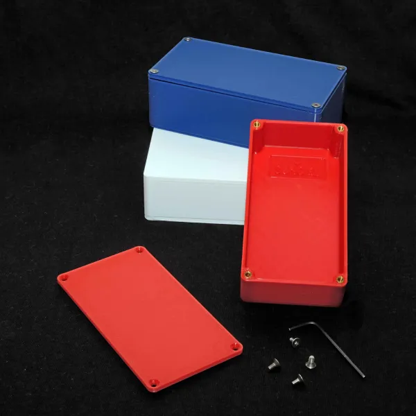 Three plastic boxes in red, white and blue